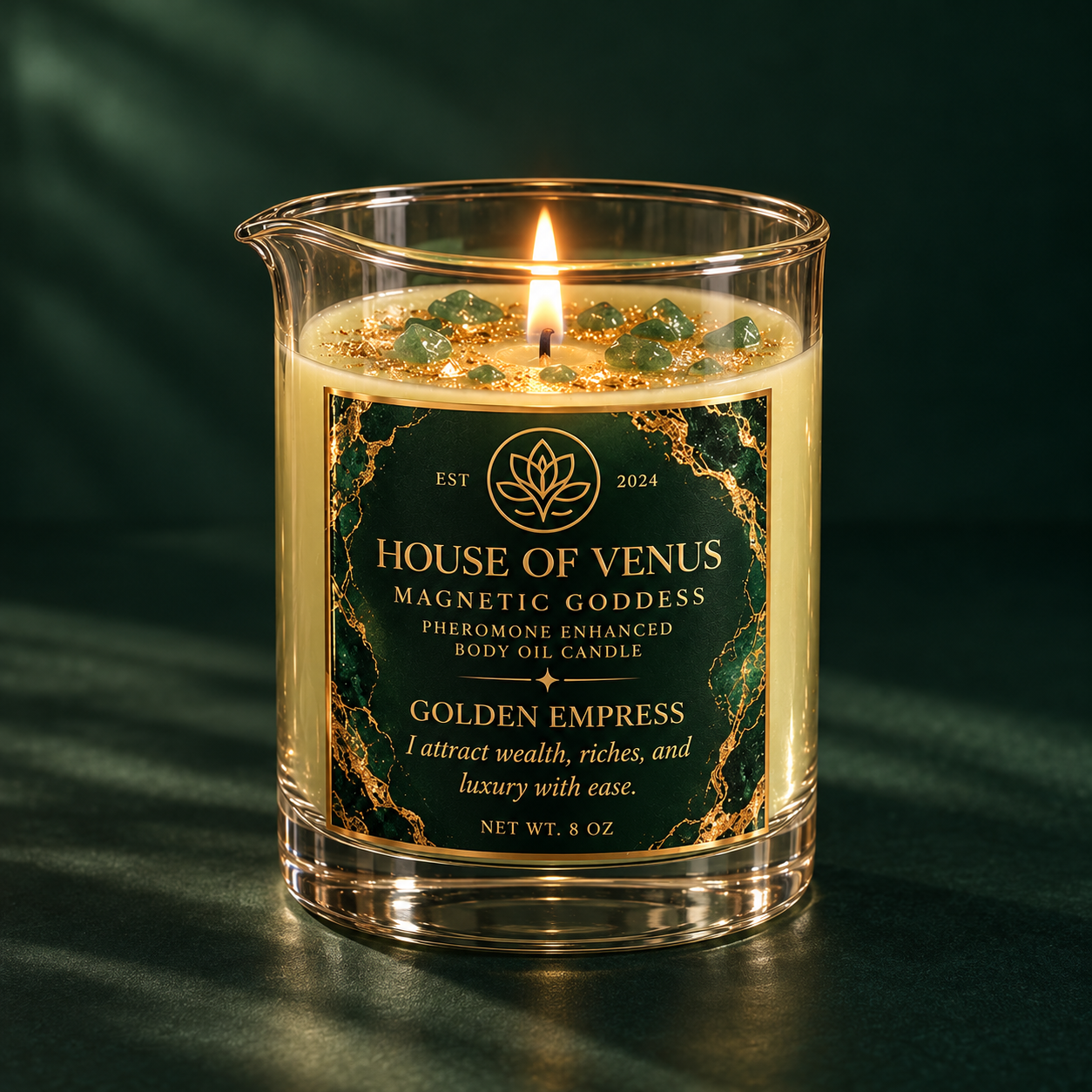 Softly blurred preview of the emerald and gold Golden Empress candle