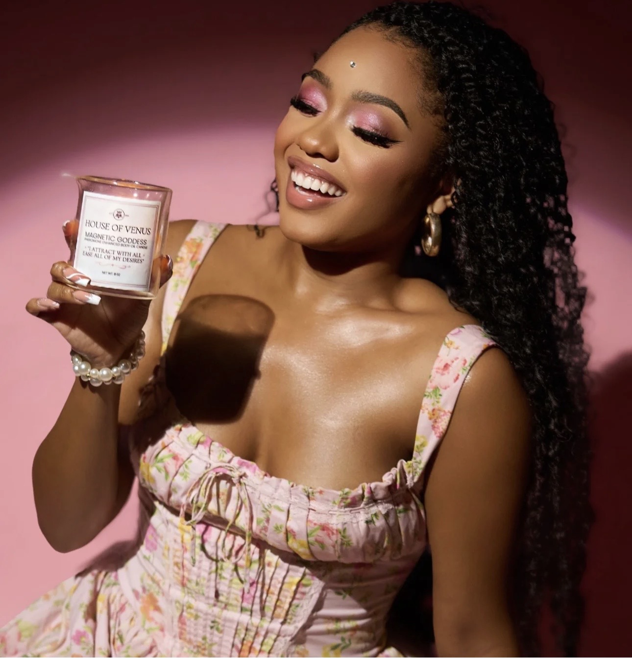 Jaelyn holding her House of Venus candle